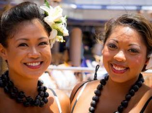 Two women of color in traditional clothing